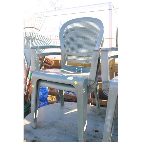 36 - Plastic garden, patio table and set a four chairs