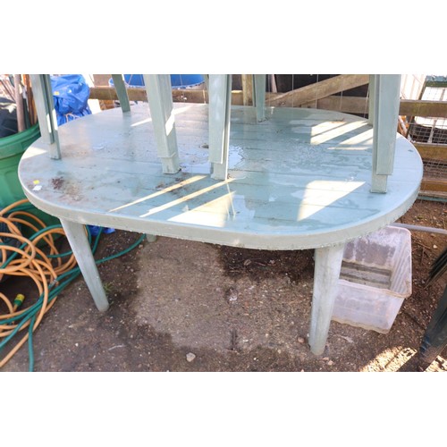 36 - Plastic garden, patio table and set a four chairs