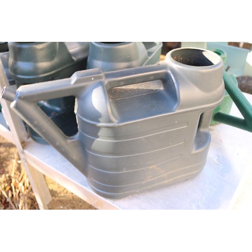 67 - 7 x plastic watering cans