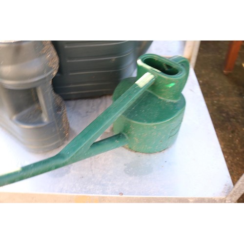 67 - 7 x plastic watering cans