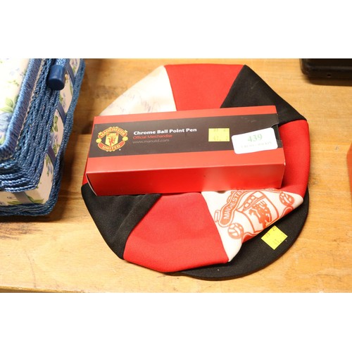 439 - Manchester United cap - signed by Bobby Moore & Trevor Brooking & an official pen