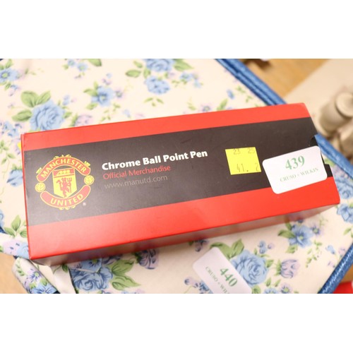 439 - Manchester United cap - signed by Bobby Moore & Trevor Brooking & an official pen