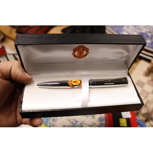 439 - Manchester United cap - signed by Bobby Moore & Trevor Brooking & an official pen