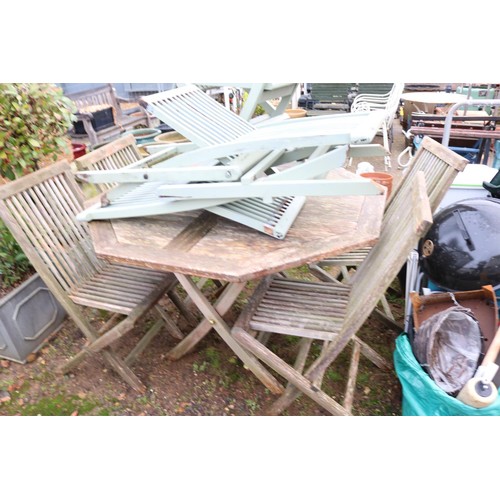 37 - Hexagon all wooden outside table and set of seven wooden chairs