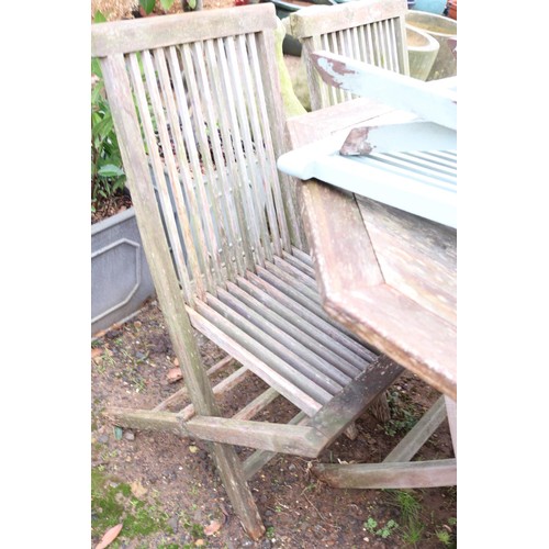 37 - Hexagon all wooden outside table and set of seven wooden chairs