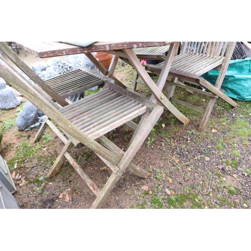 37 - Hexagon all wooden outside table and set of seven wooden chairs