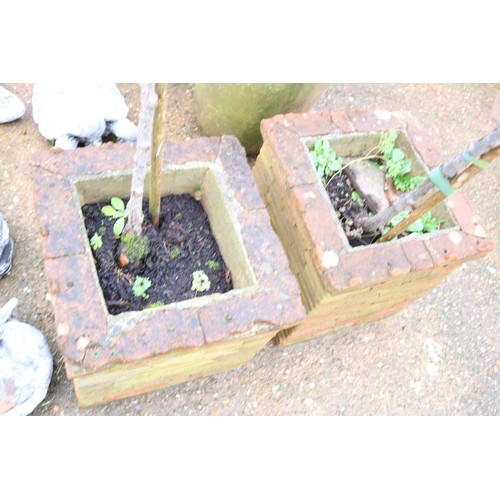 41 - Pair of large brick garden planters and rose bushes