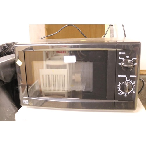 120 - Black George Home microwave - warranted until 12 noon Tuesday following the above sale