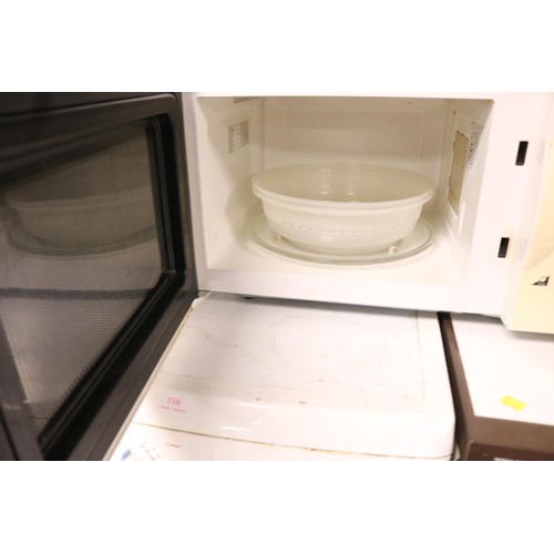 121 - Delonghi microwave - warranted until 12 noon Tuesday following the above sale