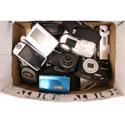 583 - Box containing various cameras