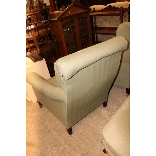 529 - Green upholstered easy chair/fire side on metal castors