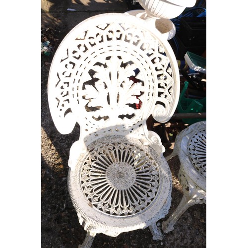 70 - Victorian reproduction, metal patio table and three chairs