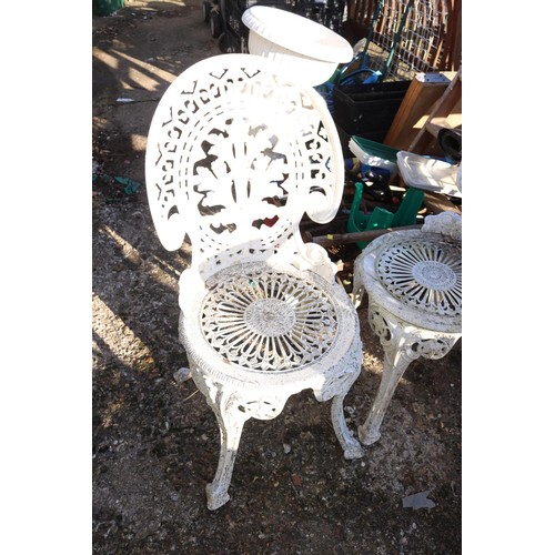 70 - Victorian reproduction, metal patio table and three chairs