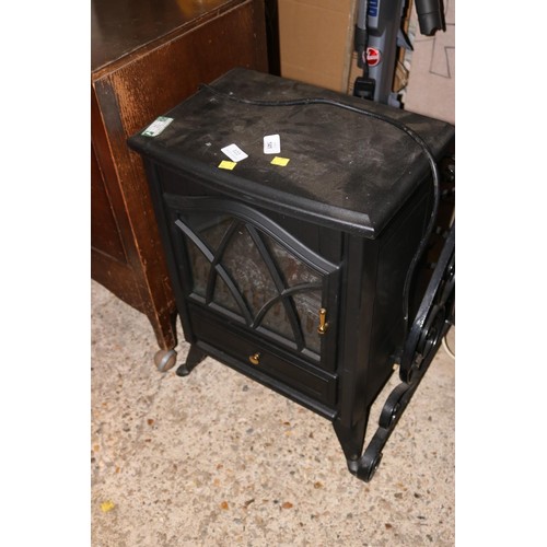 122 - Electric log effect heater - warranted until noon Tues following the above sale