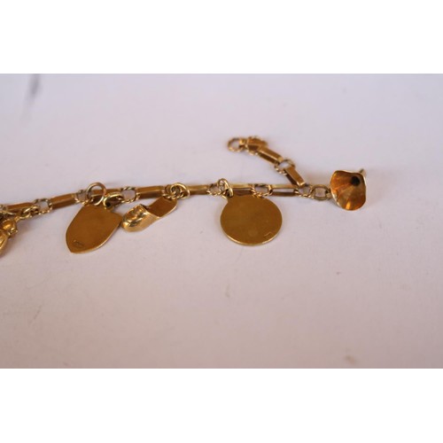 441E - 9ct gold charm bracelet - 14gms total