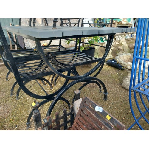 63 - Wrought iron table, wooden top & 6 chairs