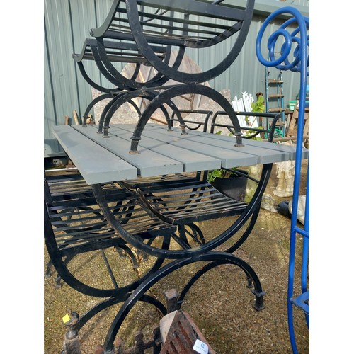 63 - Wrought iron table, wooden top & 6 chairs