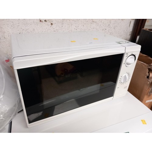 120 - White microwave - warranted until 12 noon Tuesday following the above sale