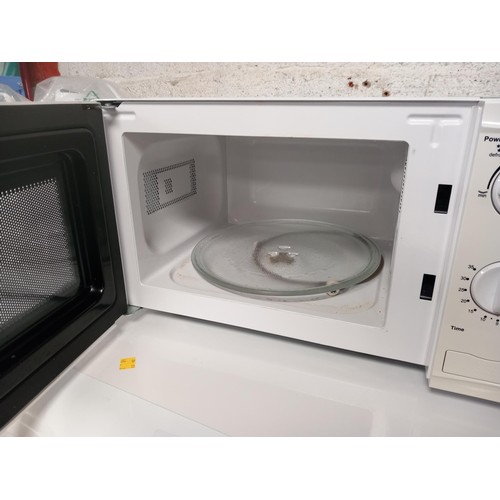 120 - White microwave - warranted until 12 noon Tuesday following the above sale