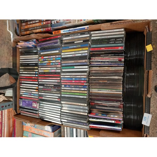 325 - 3 boxes of DVD's, CD's, videos & tapes