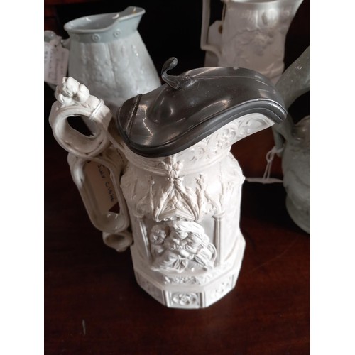 517 - 9 Victorian relief moulded jugs