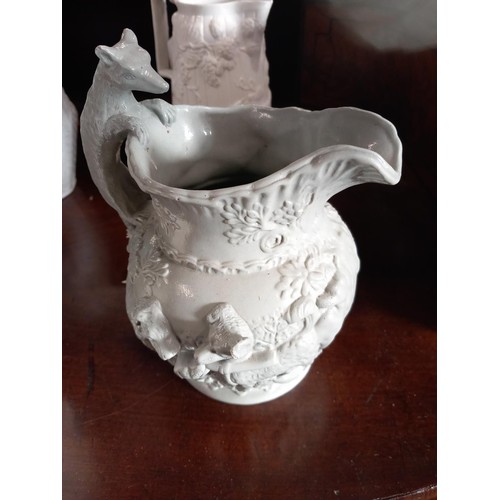 517 - 9 Victorian relief moulded jugs