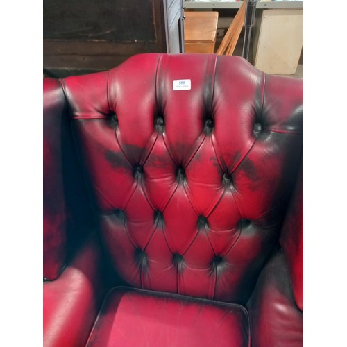 588 - Red leather wing back chair