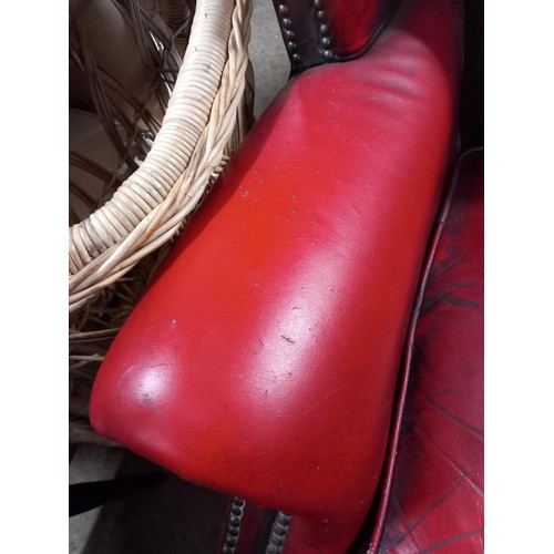 588 - Red leather wing back chair