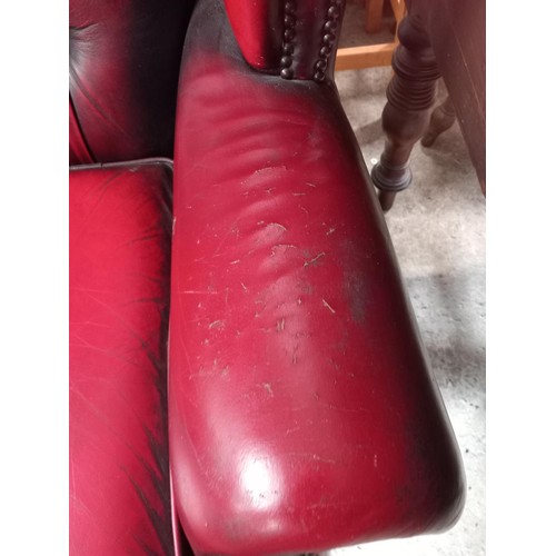 588 - Red leather wing back chair