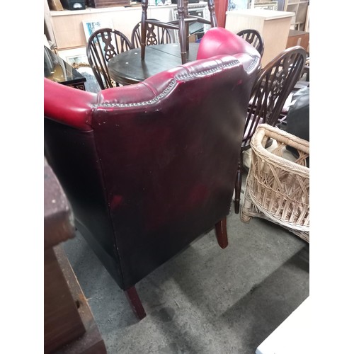 588 - Red leather wing back chair