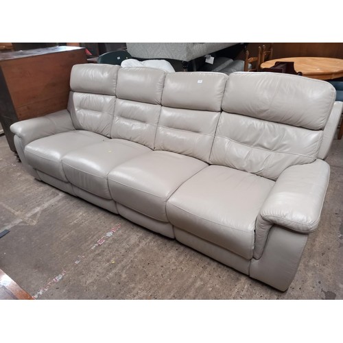 610 - Cream leather electric reclining sofa with USB ports - warranted until 12 noon Tuesday following the... 