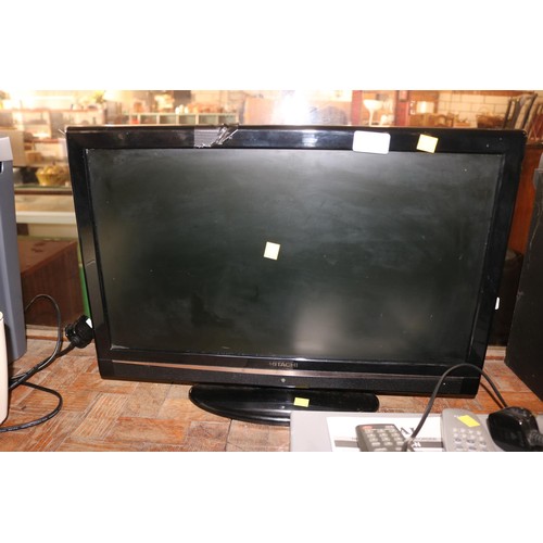 271 - Hitachi tv with remote - warranted until 12 noon Tuesday following the above sale