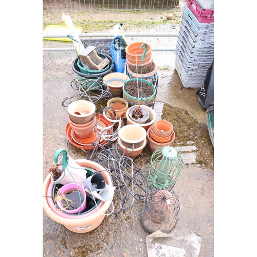 28 - Various planters, hanging baskets, bird feeders, metal stands & canes