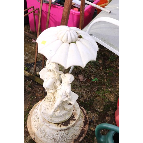 53 - Garden ornament, lovers under brolly