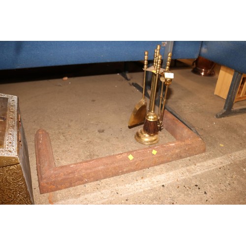 340 - Cast fire hearth surround, brass fireside set