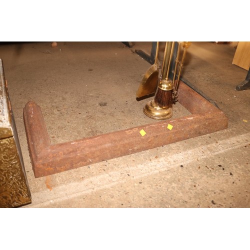 340 - Cast fire hearth surround, brass fireside set