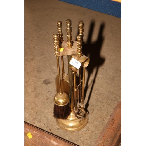 340 - Cast fire hearth surround, brass fireside set