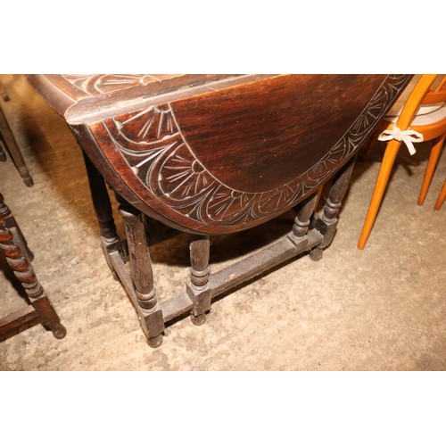 610 - Drop leaf carved table