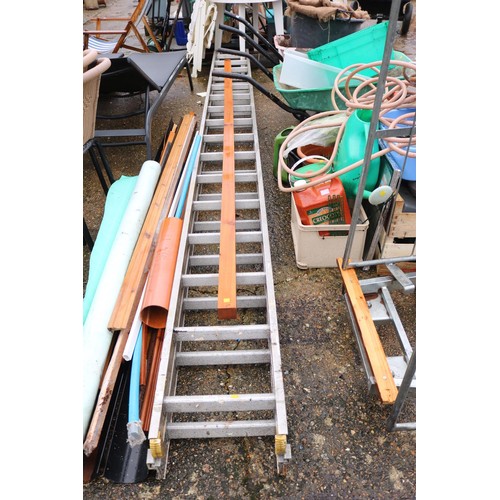 63 - Large double aluminium D wrong extension ladder & piece of timber