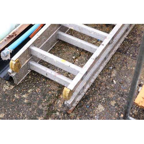 63 - Large double aluminium D wrong extension ladder & piece of timber