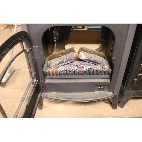 124 - Dimplex log effect electric fire - warranted until 12 noon Tuesday following the above sale