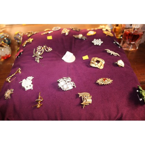 433 - Cushion of various brooches