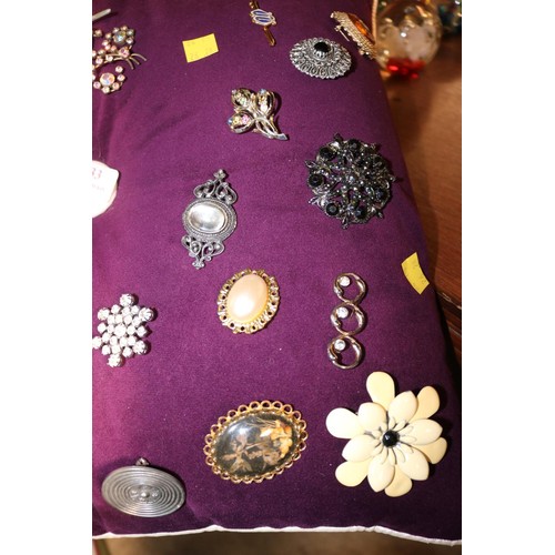 433 - Cushion of various brooches