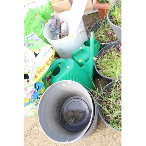 62 - 2 watering cans, 3 planters, garden fence pack & bucket of ornaments