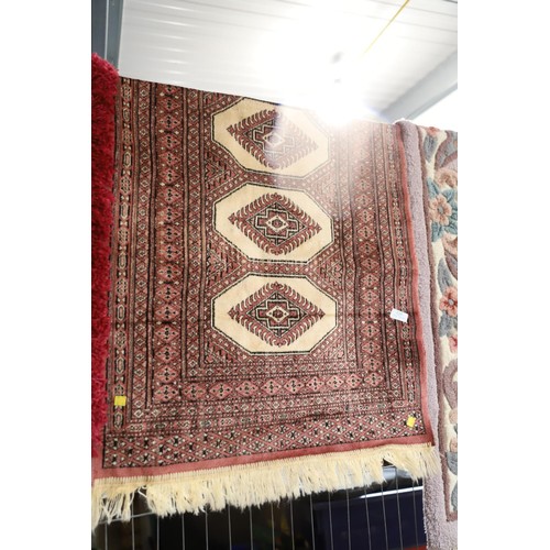 125 - Red patterned rug with fringe