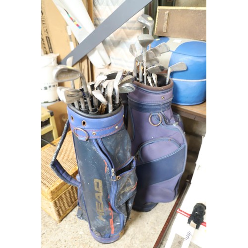 136 - 2 bags of various golf clubs
