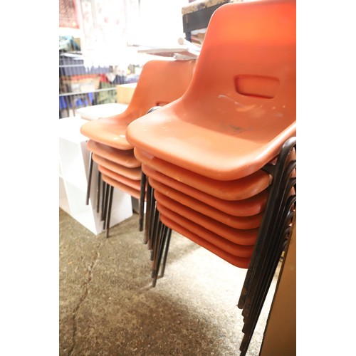 223 - 12 vintage stacking chairs, orange seats & tubular frames