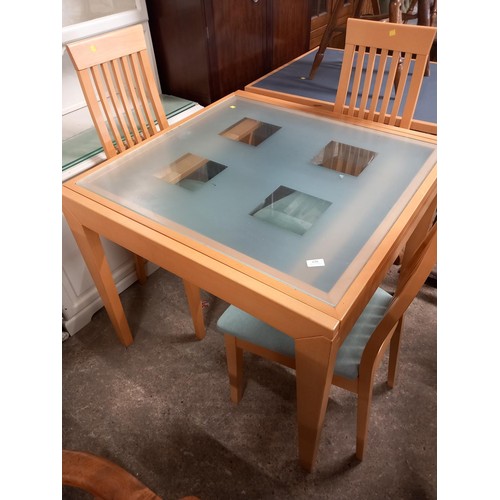 580 - Glass top table & 4 chairs