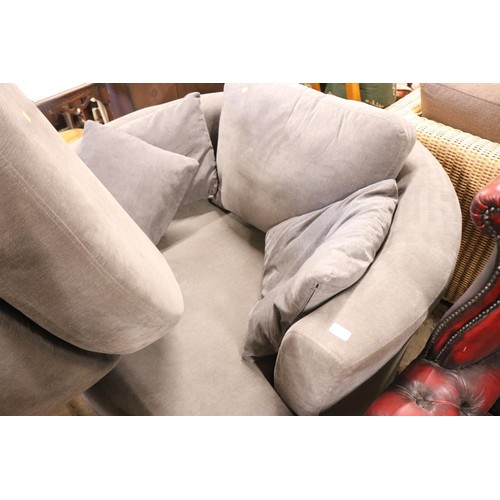 607 - Large circular revolving 'cuddler' chair & matching footstool