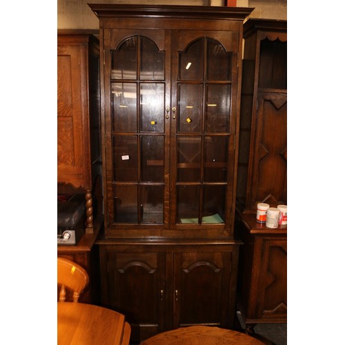 631 - Tall oak display case & cupboard